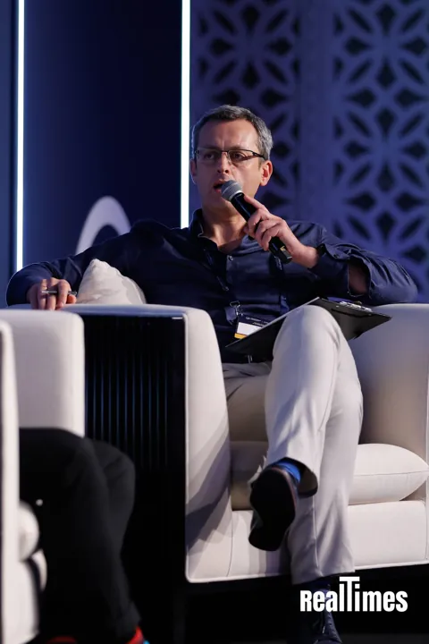 Alexander Morari speaking on the blue stage at PropTech Connect Middle East 2026 in Dubai.
