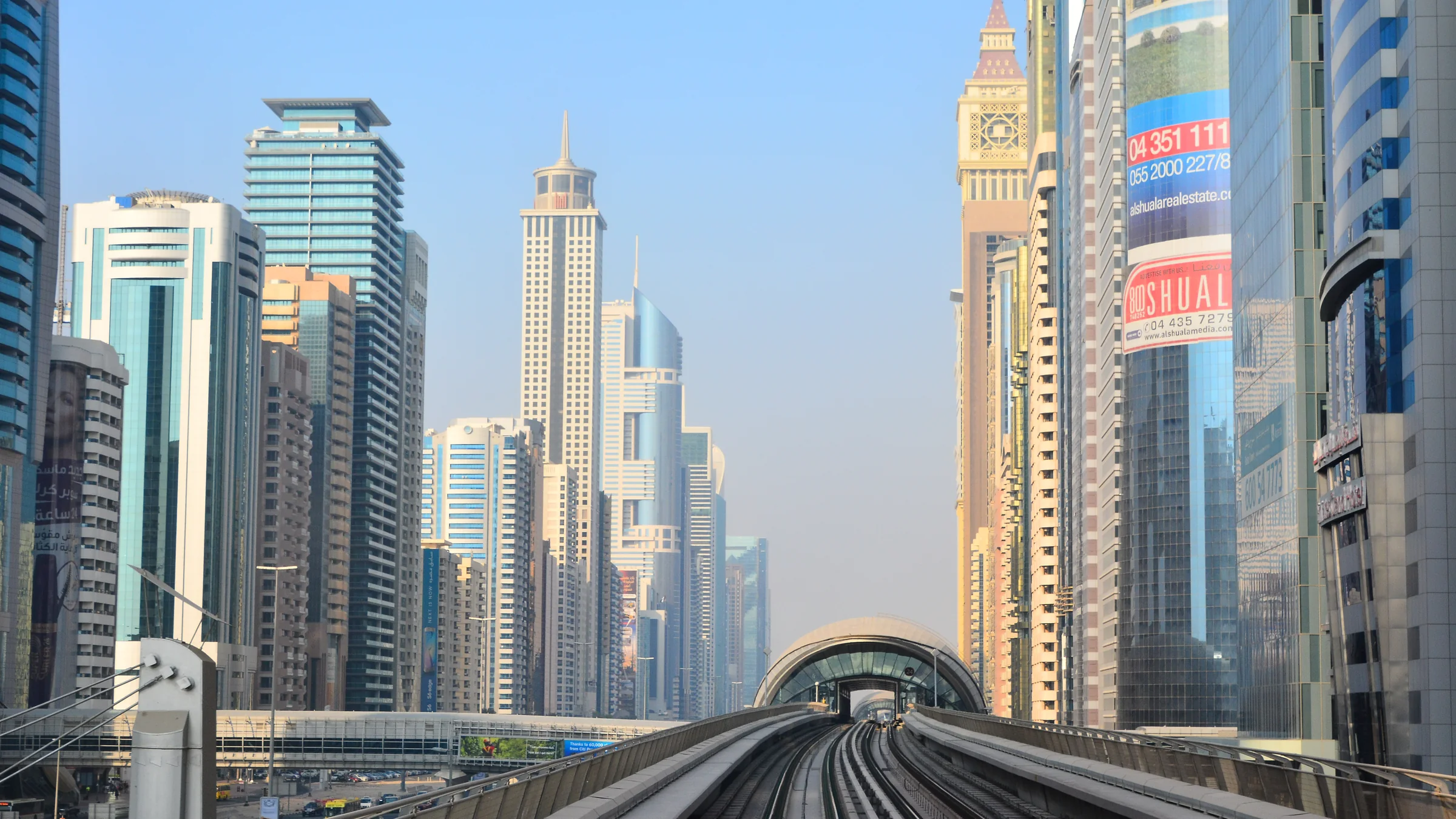 Sheikh Zayed Road office and residential towers in daylight from the Dubai Metro line, the corridor where new supply is rising