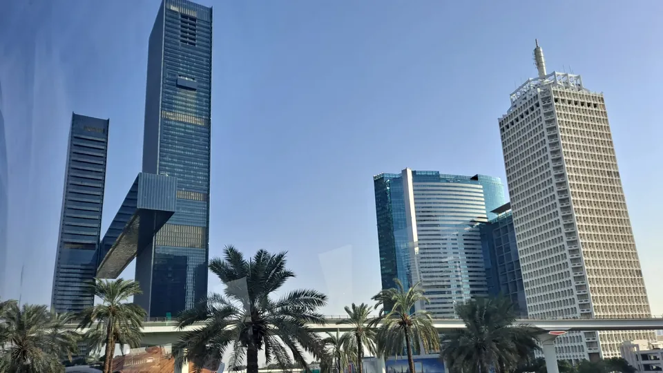 Glass office towers and palms along Sheikh Zayed Road, the prime corridor where Grade A space is tightest