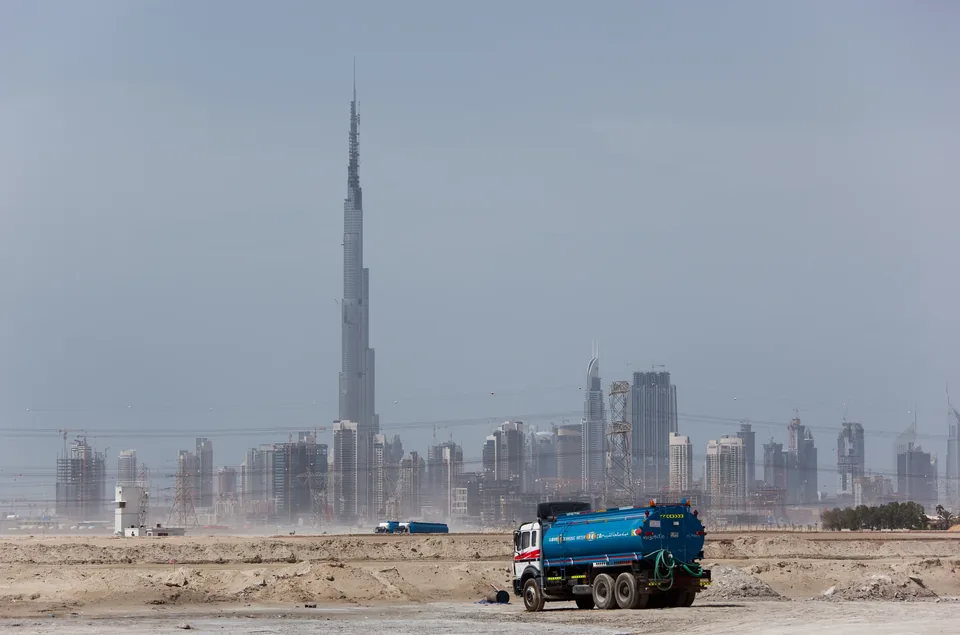 Distant Dubai skyline with Burj Khalifa rising over the Sheikh Zayed Road tower cluster